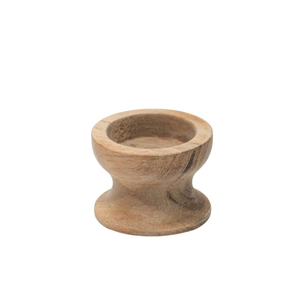 A small handcrafted wooden tea light holder with a flared base, made from natural light brown wood with visible grain patterns, isolated on a white background.