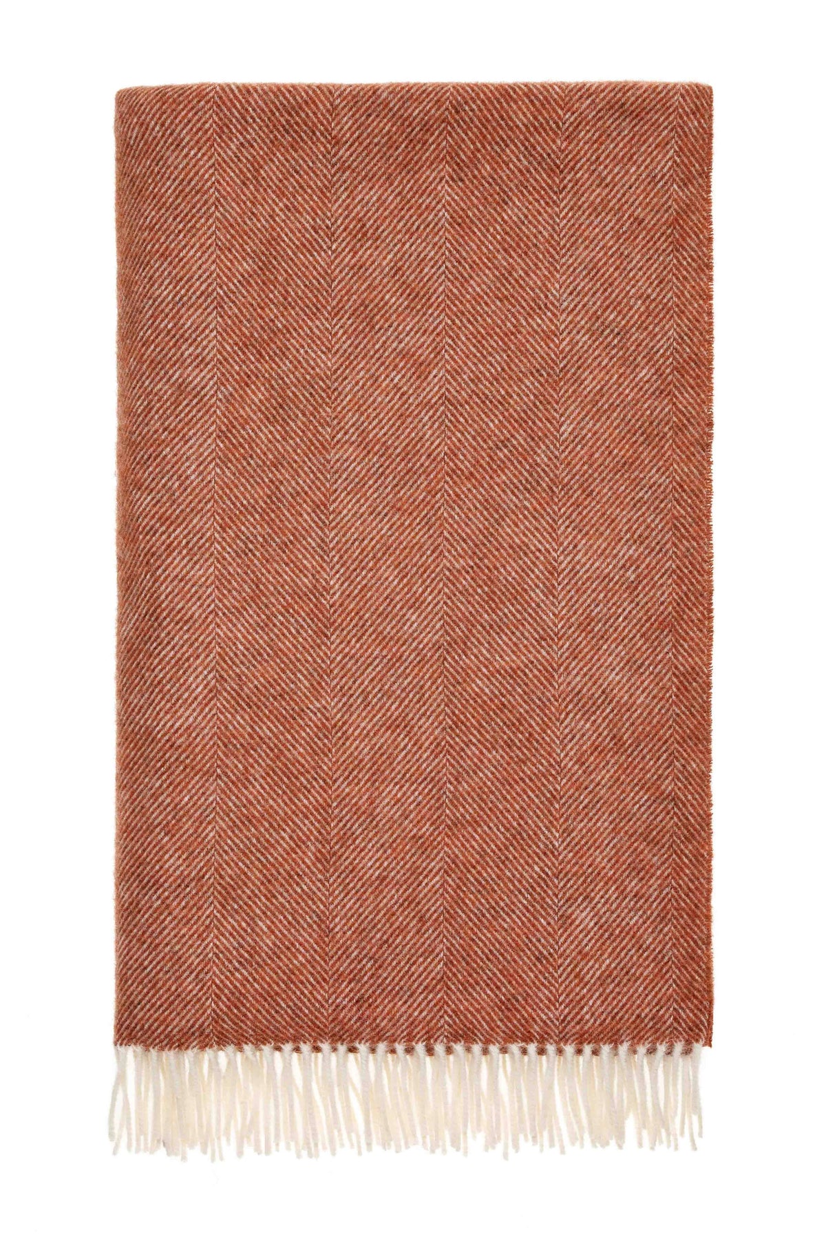 Textured brick coloured British wool blanket with white fringe on a white background