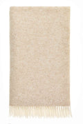 Beige and cream British wool throw in a classic herringbone weave with fringed edges, laid flat on a neutral background.