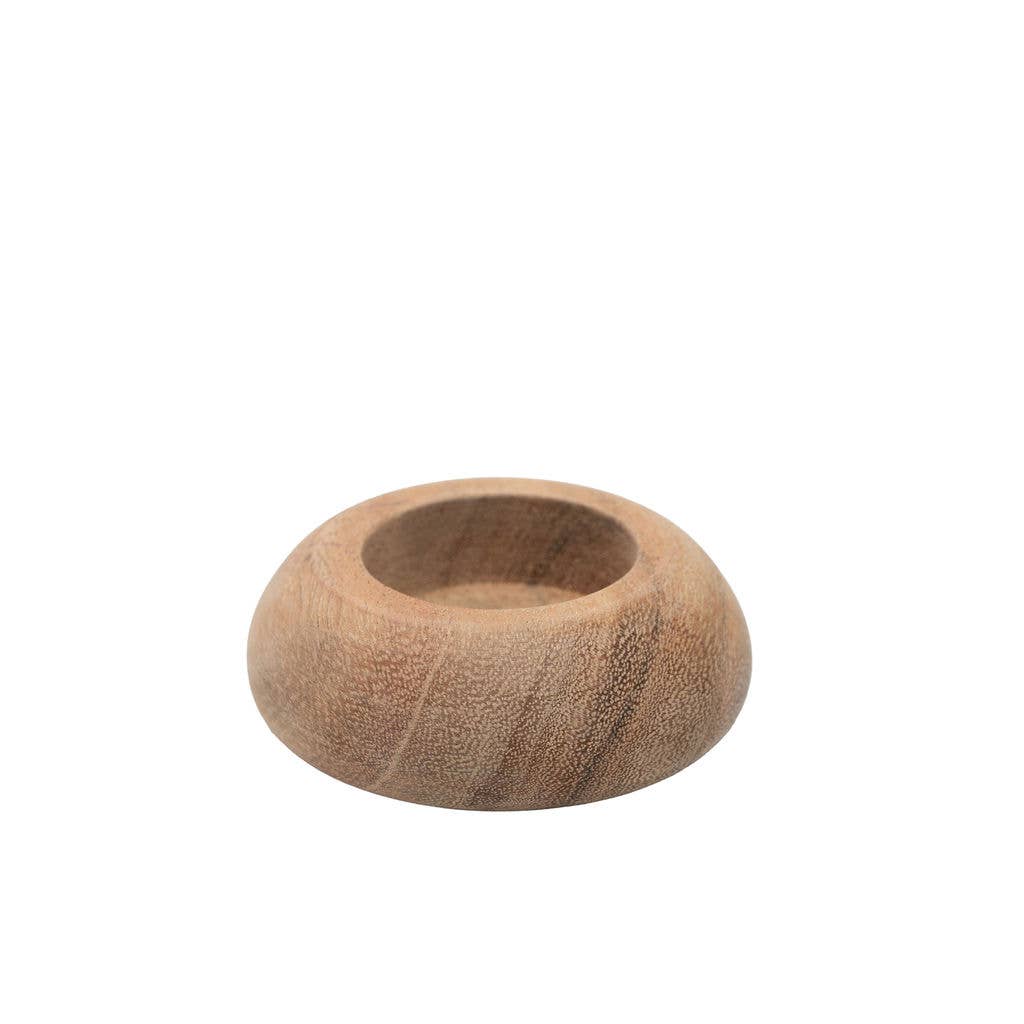 A small round wooden tea light holder with a smooth, rounded exterior and a shallow, open centre, shown on a plain white background.