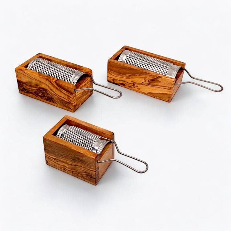 Natural wood cheese graters with stainless steel surfaces on a clean white background.