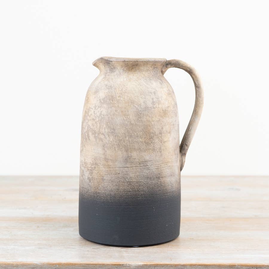 Oti 26cm terracotta jug vase with handle and natural ombre finish displayed on a wooden surface.