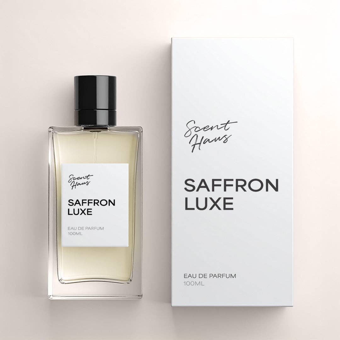 A 100ml bottle of Saffron Luxe Eau de Parfum by Scent Haus next to its white packaging box, set against a light beige background.