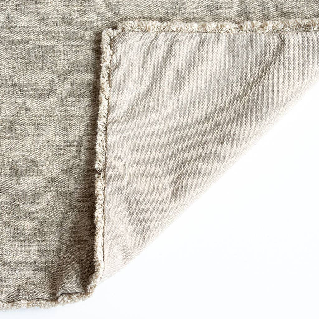 Detailed texture view of Westley linen cushion cover showing raw natural material cushion cover on a white background.